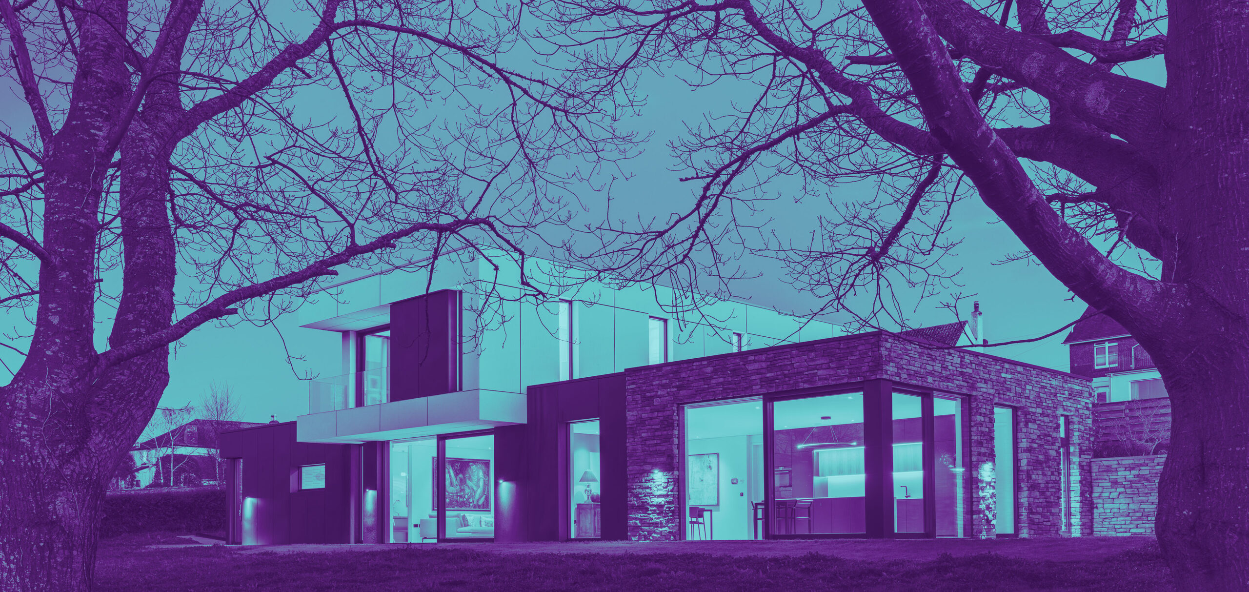 Contemporary Devon home illuminated at dusk