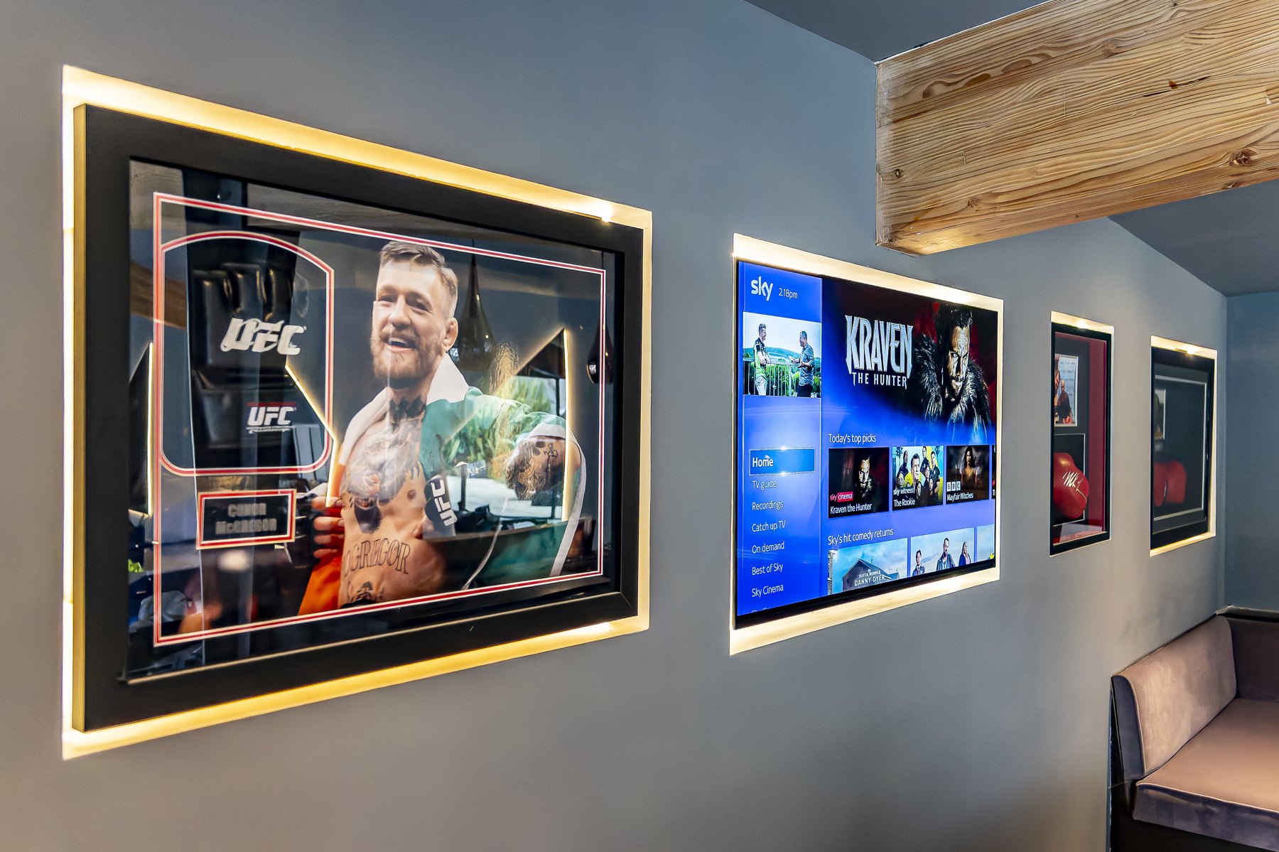 Media room with illuminated framed artwork