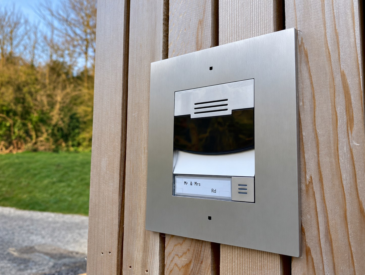 Door entry intercom mounted beside a front door