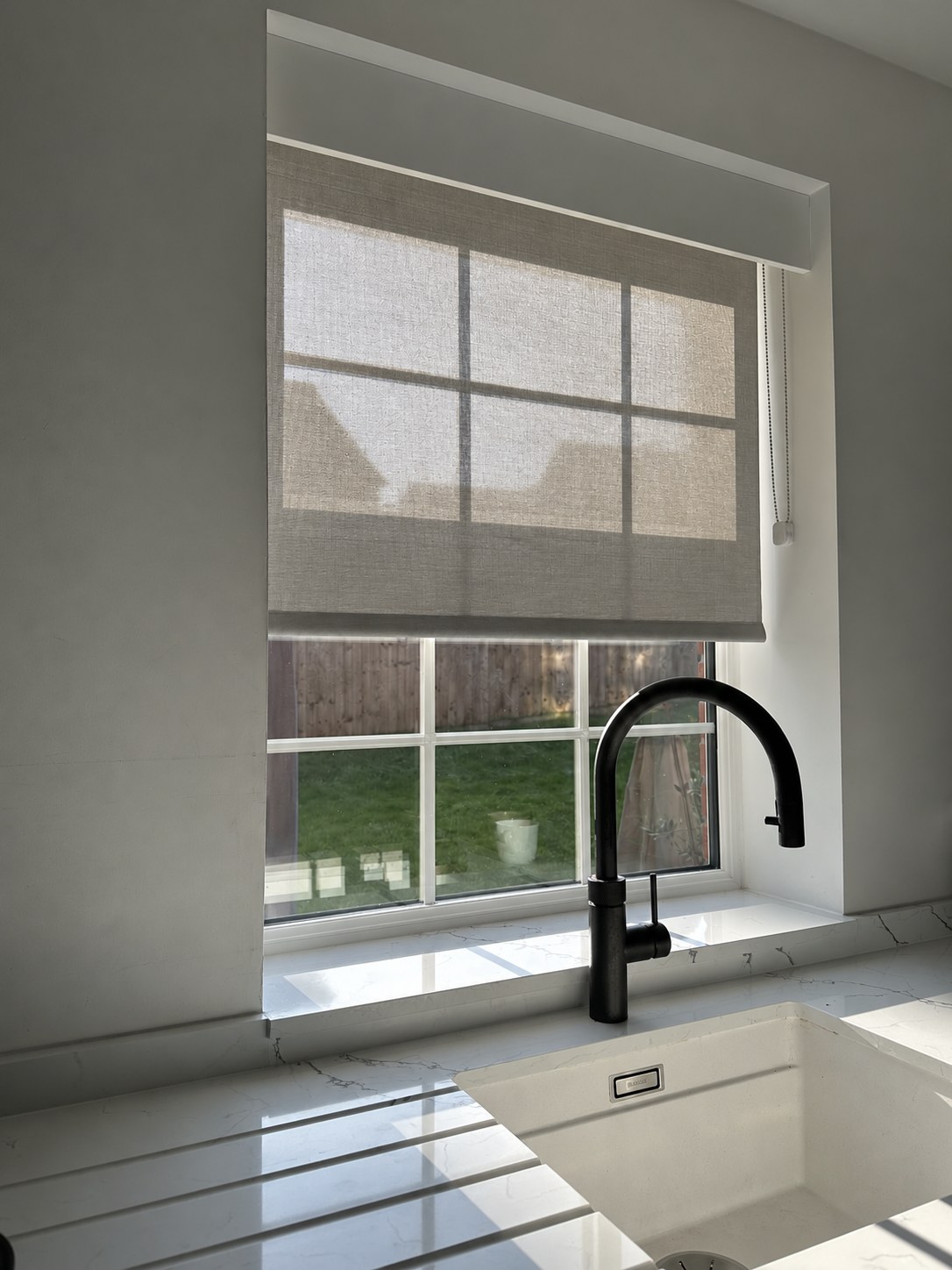 Roller blind above a kitchen window